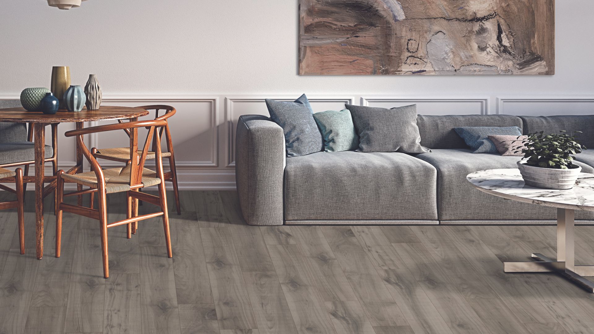 Grey laminate wood flooring in a living space.
